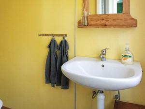 a bathroom with a white sink and a mirror at 6 person holiday home in SÖLVESBORG-By Traum in Sölvesborg