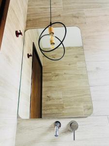 a chandelier hanging over a sink in a room at Harmony Seaside Pelion in Platanias
