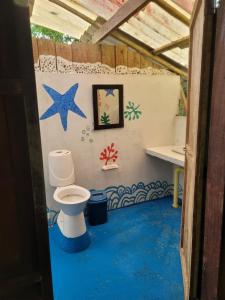 a bathroom with a toilet in a building at Ecohotel Bahía Terco in Nuquí
