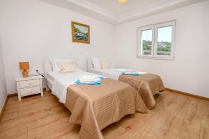 Postel nebo postele na pokoji v ubytování Apartments Silvana