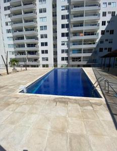a swimming pool in front of some tall buildings at 1002 - Apartamento en Palmetto exclusivo al norte in Valledupar