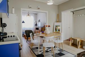 a kitchen and dining room with a table and chairs at Forget Me Not in Kavála