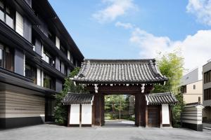 an entrance to a building with a chinese gate at HOTEL THE MITSUI KYOTO, a Luxury Collection Hotel & Spa in Kyoto