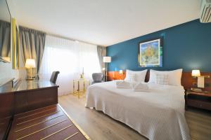 Postel nebo postele na pokoji v ubytování Tulip Inn Beaulieu Lausanne