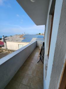 a balcony with a view of a building at Kalmuk Apartment Hotel in Trabzon