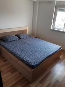 a bedroom with a bed in a room at Apartments Josif in Gevgelija