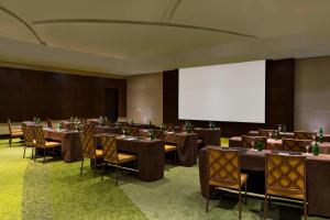 a conference room with tables and chairs and a screen at The Westin Panama in Panama City +66 photos