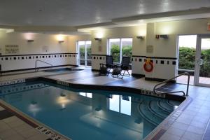 a swimming pool with a slide in the middle at Fairfield Inn & Suites by Marriott Sault Ste. Marie in Sault Ste. Marie