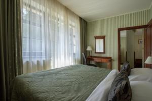 Postel nebo postele na pokoji v ubytování Hotel Morris Relax & Wellness