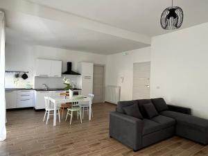 a living room with a couch and a table at So.Fi. Home in San Benedetto del Tronto