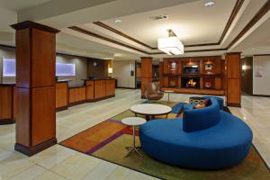 a lobby with a blue couch and a table at Fairfield Inn and Suites by Marriott El Paso in El Paso