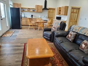 a living room with a couch and a table at Dream Drift Motel in Cameron