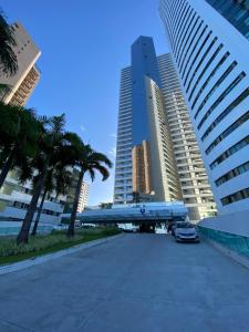 a parking lot in a city with tall buildings at Recife Flats Beach Class Internacional in Recife