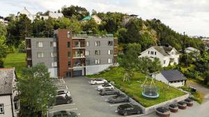 an aerial view of a parking lot with cars parked at Lofoten Studio Apartment, Vestermyrveien 11 Svolvær in Svolvær