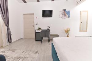 Televízia a/alebo spoločenská miestnosť v ubytovaní Luxury Rooms "Kaleta"