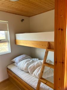 a bunk bed in a tiny house at Víðilundur 17 in Varmahlid