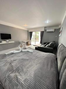 a bedroom with a bed with a white towel on it at Sea sand sun Condominiums in Rayong +40 photos