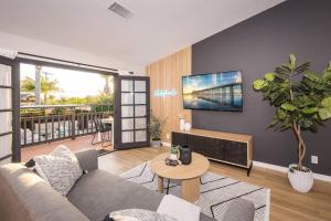 a living room with a couch and a table at Entire house - 4 Bedroom & 2 Bath, 5 Min to Beach in Oceanside