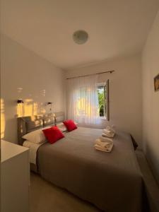 Ένα ή περισσότερα κρεβάτια σε δωμάτιο στο Apartmani Tamaris