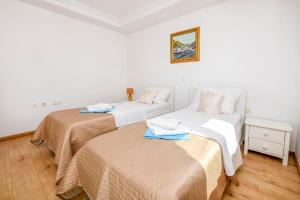 Postel nebo postele na pokoji v ubytování Apartments Silvana