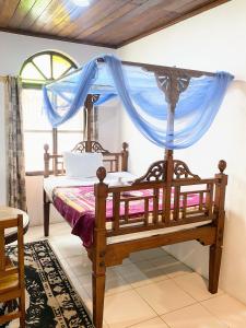 Postel nebo postele na pokoji v ubytování Garden Lodge