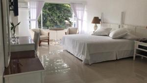 Cama o camas de una habitación en Hotel Zaracay