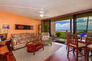 a living room with a couch and a table at SUGAR BEACH RESORT, #121 condo in Kihei