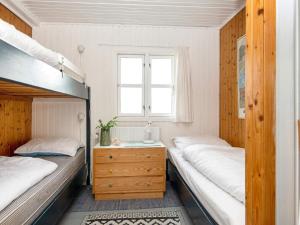 a bedroom with two bunk beds and a window at Holiday home Struer XXV in Struer