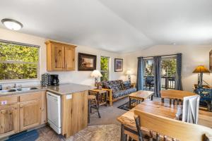 a kitchen and living room with a couch and a table at Alpine #1 in West Yellowstone