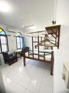 Postel nebo postele na pokoji v ubytování Garden Lodge