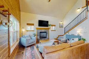 a living room with a couch and a fireplace at Dover Bay Way in Dover