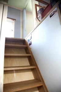 a set of stairs leading up to a refrigerator at Camp k in Mokpo