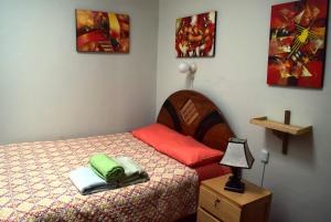 Carlos Guest House 2 Cusco客房内的一张或多张床位