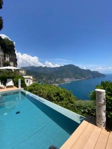a swimming pool with a view of the ocean at Villa San Cosma in Ravello