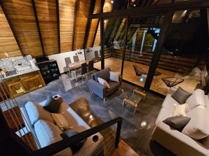 an overhead view of a living room with couches at Wind Houses, Casas de Viento in Monteverde Costa Rica