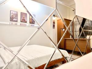 Postel nebo postele na pokoji v ubytování BÊ TÔNG RESIDENCES HOMESTAY