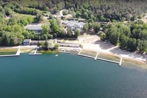an aerial view of a lake with a dock at Sieraków - Kraina 100 Jezior in Sieraków