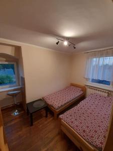 Sieraków - Kraina 100 Jezior tesisinde bir odada yatak veya yataklar