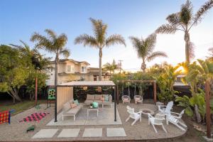 a backyard with a gazebo and chairs and a playground at Entire house - 4 Bedroom & 2 Bath, 5 Min to Beach in Oceanside