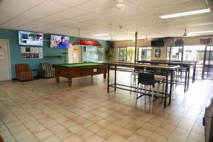 a room with ping pong tables and billards in it at Wongai Beach Hotel in Horn