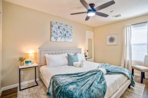 a bedroom with a bed and a ceiling fan at Pet Friendly Home by Katy in Houston