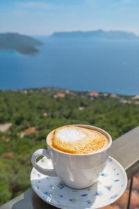 a cup of coffee on a table with a view at Golden Rose Suit pension in Kaş