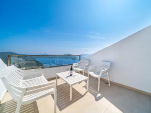two chairs and a table on a balcony with a view at Golden Rose Suit pension in Kaş