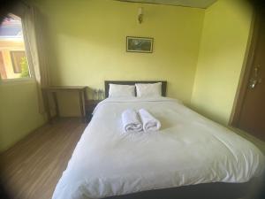 Letto o letti in una camera di Ocean Inn