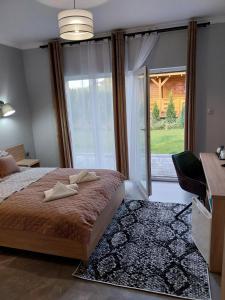 Postel nebo postele na pokoji v ubytování VILLA EDEN USTKA wypoczynek dla dorosłych