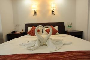 Ένα ή περισσότερα κρεβάτια σε δωμάτιο στο Apsara Boutique Hotel