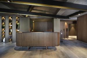 a lobby with a reception desk in a building at Grand Hotel Campione in Campione dʼItalia