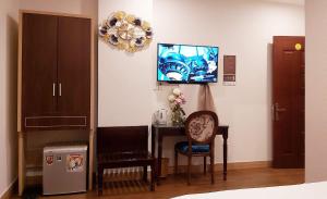 TV a/nebo společenská místnost v ubytování Milan Diamond Hotel
