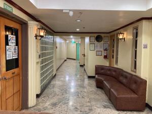 a hallway of a hospital with a couch in it at Demiren Hotel in Cagayan de Oro