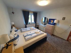 a hotel room with two beds and a television at Ferienwohnung Kühnel in Zell im Fichtelgebirge